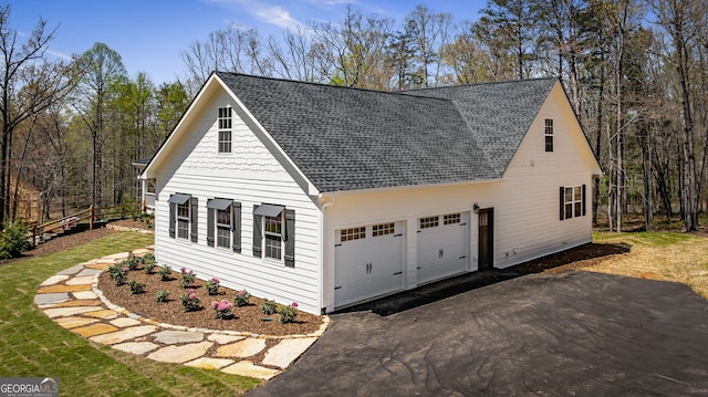 219 Fairview Dr, Morganton, GA 30560 - view of front of house with an attached garage, roof with shingles, and asphalt driveway