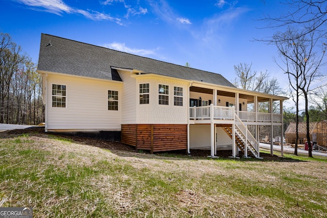 219 Fairview Dr, Morganton, GA 30560 - back of house featuring a shingled roof, stairway, and a yard