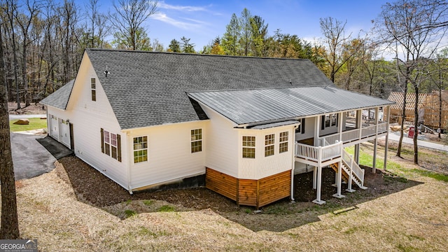 219 Fairview Dr, Morganton, GA 30560 - rear view of house with a shingled roof, a garage, stairway, and a porch