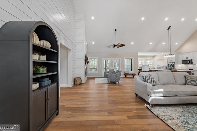 219 Fairview Dr, Morganton, GA 30560 - living area featuring high vaulted ceiling, light wood-style floors, ceiling fan, and recessed lighting