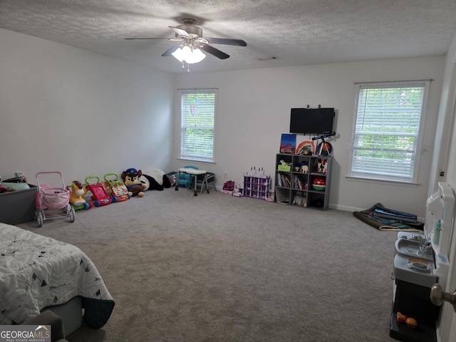 10315 Whisper Glen Dr, Midland, GA 31820 - carpeted bedroom with a textured ceiling and ceiling fan