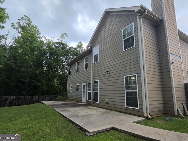 10315 Whisper Glen Dr, Midland, GA 31820 - rear view of house with a patio and a chimney