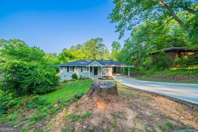 4457 Lincoln Jones Rd, Ellenwood, GA 30294 - ranch-style home with driveway, a carport, and a front yard