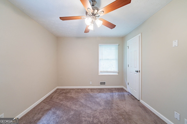 4457 Lincoln Jones Rd, Ellenwood, GA 30294 - spare room with baseboards, carpet flooring, and ceiling fan