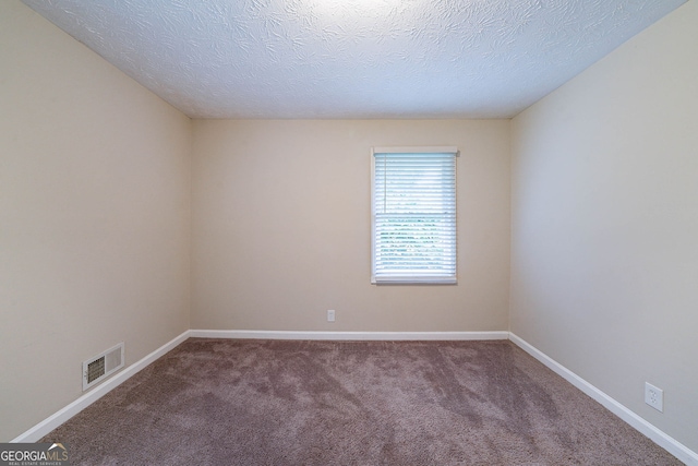 4457 Lincoln Jones Rd, Ellenwood, GA 30294 - carpeted empty room featuring baseboards and a textured ceiling