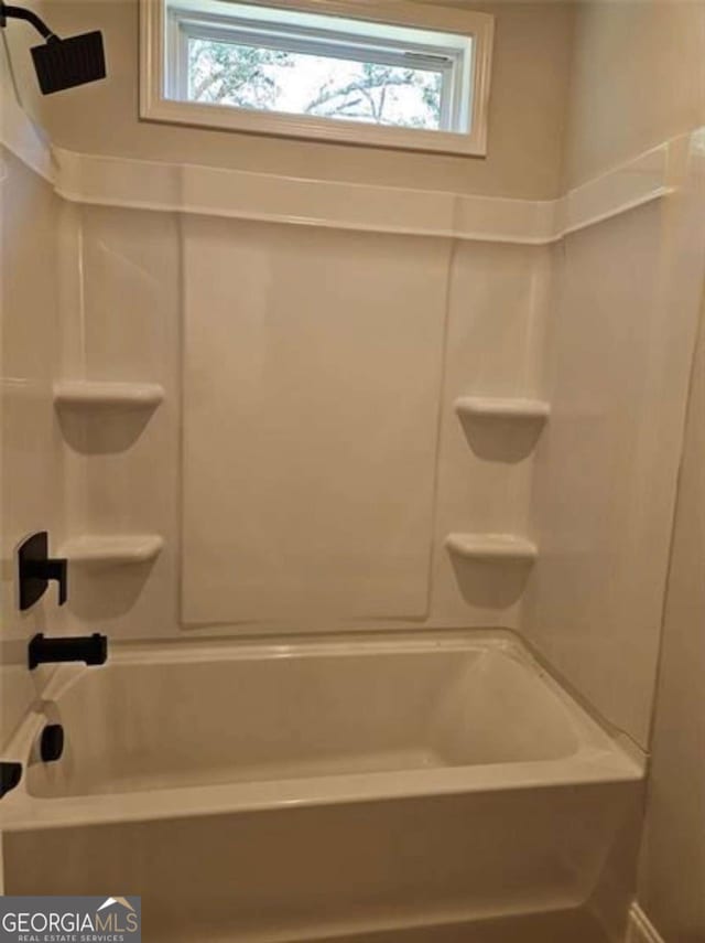 1695 Crumbley Rd Unit 3, Mcdonough, GA 30252 - full bathroom with plenty of natural light and washtub / shower combination