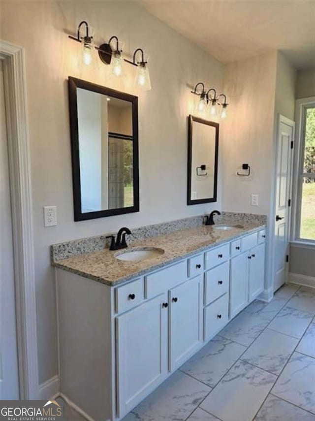 1695 Crumbley Rd Unit 3, Mcdonough, GA 30252 - full bath featuring marble look tiles, double vanity, and baseboards
