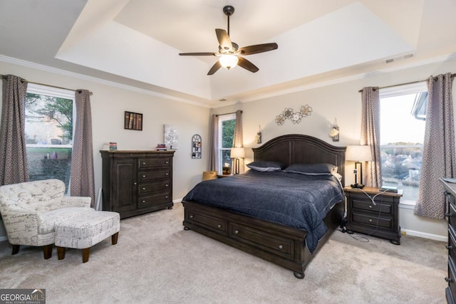 271 Double Gate Ct, Sugar Hill, GA 30518 - bedroom featuring a tray ceiling, light carpet, ornamental molding, and a ceiling fan