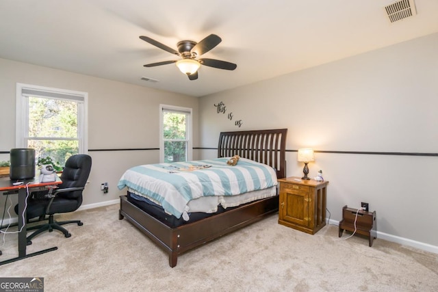 271 Double Gate Ct, Sugar Hill, GA 30518 - bedroom with light colored carpet, a ceiling fan, and an office area
