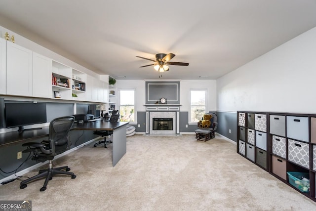 271 Double Gate Ct, Sugar Hill, GA 30518 - office area featuring ceiling fan, healthy amount of natural light, a premium fireplace, and light carpet