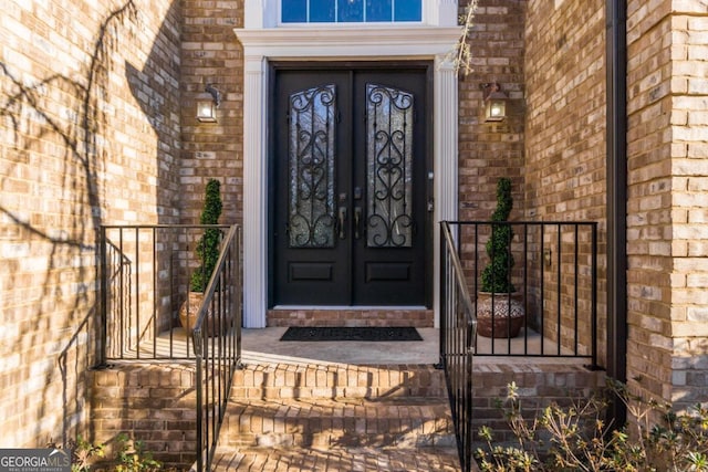 271 Double Gate Ct, Sugar Hill, GA 30518 - doorway to property featuring brick siding and french doors