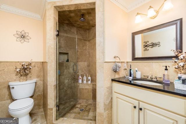 271 Double Gate Ct, Sugar Hill, GA 30518 - bathroom featuring tile walls, ornamental molding, vanity, a stall shower, and a wainscoted wall