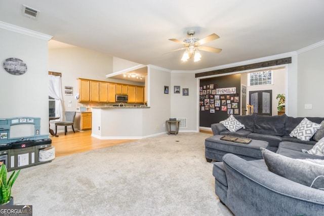 271 Double Gate Ct, Sugar Hill, GA 30518 - living area featuring light colored carpet, ornamental molding, and a ceiling fan