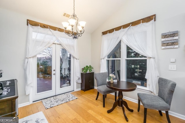 271 Double Gate Ct, Sugar Hill, GA 30518 - sitting room featuring a chandelier, wood finished floors, french doors, and lofted ceiling