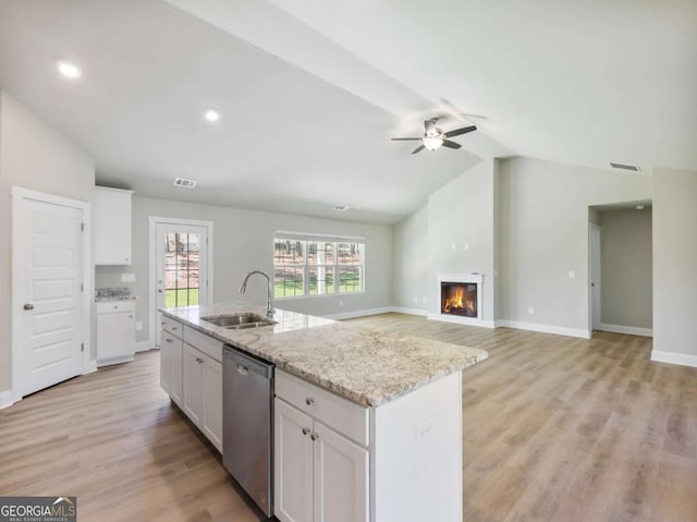 204 Rachel Ln, Hartwell, GA 30643 - kitchen featuring stainless steel dishwasher, a sink, vaulted ceiling, white cabinetry, and ceiling fan