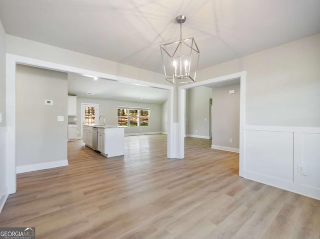 204 Rachel Ln, Hartwell, GA 30643 - unfurnished living room with a chandelier and light wood-style floors