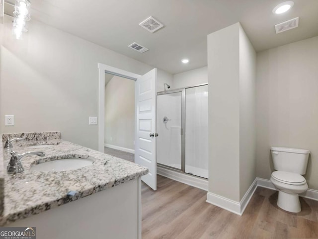 204 Rachel Ln, Hartwell, GA 30643 - full bathroom with wood finished floors, a stall shower, double vanity, baseboards, and recessed lighting