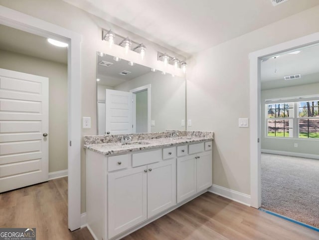 204 Rachel Ln, Hartwell, GA 30643 - full bath with double vanity, baseboards, and wood finished floors