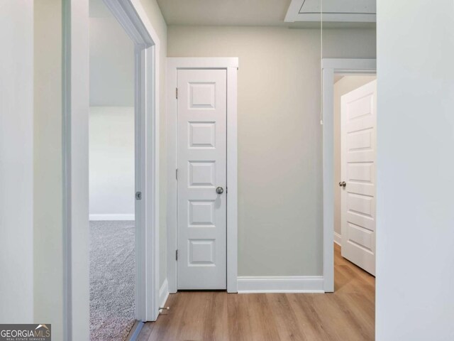 204 Rachel Ln, Hartwell, GA 30643 - corridor with attic access, light wood finished floors, and baseboards