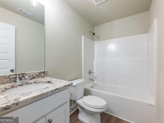 204 Rachel Ln, Hartwell, GA 30643 - full bathroom with toilet, wood finished floors, vanity, and tub / shower combination
