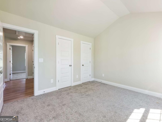 204 Rachel Ln, Hartwell, GA 30643 - unfurnished bedroom with attic access, vaulted ceiling, carpet flooring, and baseboards