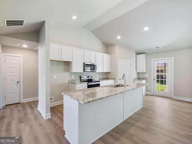 204 Rachel Ln, Hartwell, GA 30643 - kitchen with appliances with stainless steel finishes, a sink, white cabinets, baseboards, and high vaulted ceiling