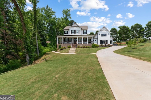 4110 Gentle Breeze Way, Braselton, GA 30517 - view of front of house with a porch, driveway, and a front yard