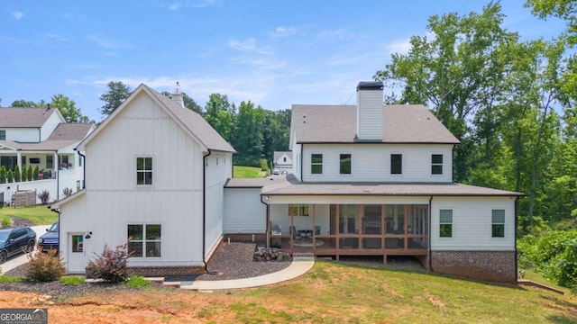 4110 Gentle Breeze Way, Braselton, GA 30517 - rear view of house featuring a chimney, central AC, a lawn, a shingled roof, and board and batten siding