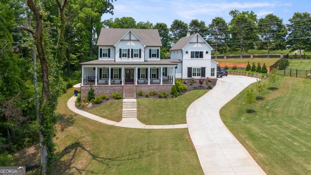 4110 Gentle Breeze Way, Braselton, GA 30517 - view of front of house featuring concrete driveway, stairs, covered porch, and a front yard