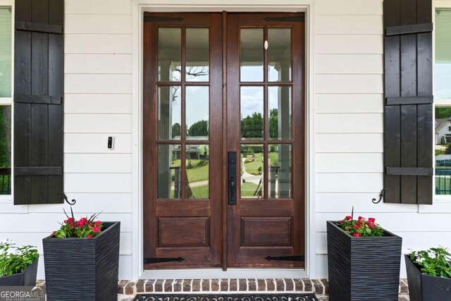 4110 Gentle Breeze Way, Braselton, GA 30517 - view of exterior entry featuring french doors