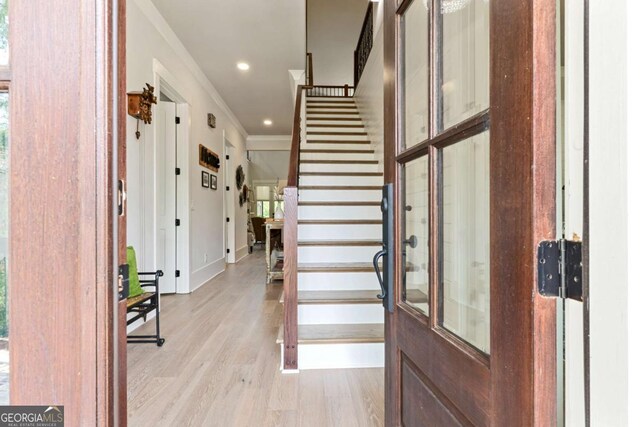4110 Gentle Breeze Way, Braselton, GA 30517 - foyer entrance with crown molding, stairs, light wood-style flooring, recessed lighting, and baseboards