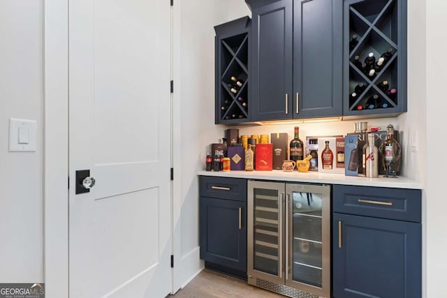 4110 Gentle Breeze Way, Braselton, GA 30517 - indoor dry bar with wine cooler and light wood finished floors