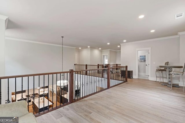 4110 Gentle Breeze Way, Braselton, GA 30517 - corridor with wood finished floors, ornamental molding, recessed lighting, and baseboards