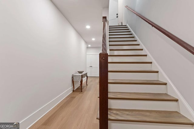 4110 Gentle Breeze Way, Braselton, GA 30517 - stairway featuring recessed lighting, wood finished floors, and baseboards