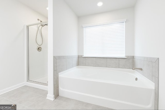 1317 Rosemary Ln # 65, East Point, GA 30344 - bathroom featuring a bath, a stall shower, and tile patterned floors