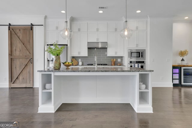 113 Quinn Way, Milton, GA 30004 - kitchen featuring open shelves, appliances with stainless steel finishes, under cabinet range hood, wine cooler, and a barn door