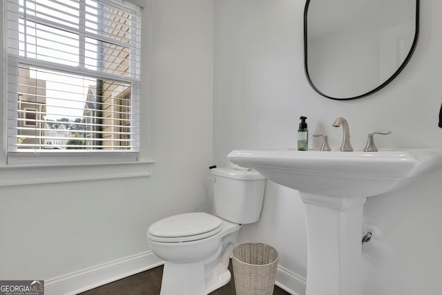 113 Quinn Way, Milton, GA 30004 - half bath with healthy amount of natural light, toilet, wood finished floors, and baseboards