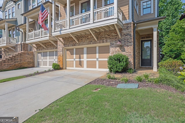 113 Quinn Way, Milton, GA 30004 - entrance to property featuring brick siding, a garage, driveway, and a balcony