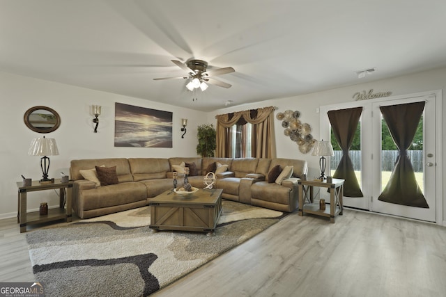 33 Easy St, Guyton, GA 31312 - living room with healthy amount of natural light, wood finished floors, and a ceiling fan
