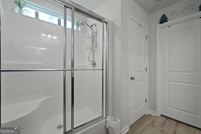 33 Easy St, Guyton, GA 31312 - bathroom featuring a shower stall, wood finished floors, and baseboards