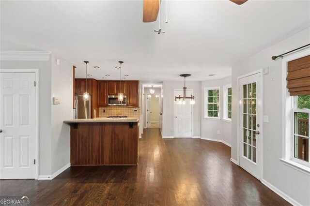 14 Augusta Way, Hiram, GA 30141 - kitchen featuring stainless steel appliances, a ceiling fan, light countertops, tasteful backsplash, and a peninsula