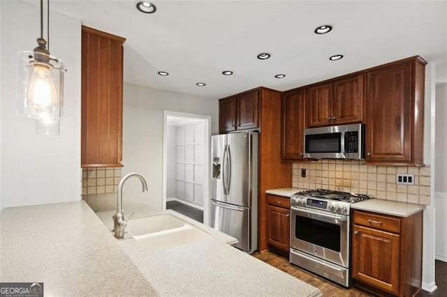 14 Augusta Way, Hiram, GA 30141 - kitchen with stainless steel appliances, a sink, decorative backsplash, light countertops, and recessed lighting