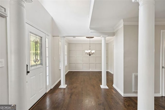 14 Augusta Way, Hiram, GA 30141 - entrance foyer with ornate columns, baseboards, wood finished floors, a chandelier, and ornamental molding