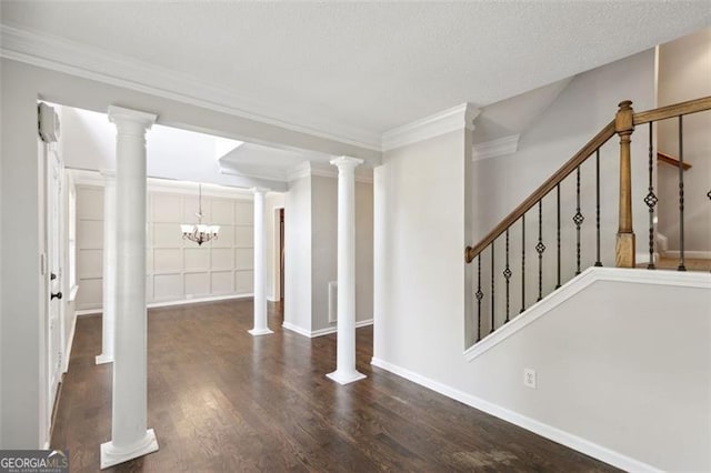 14 Augusta Way, Hiram, GA 30141 - entryway featuring a chandelier, wood finished floors, crown molding, baseboards, and stairway