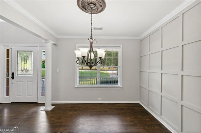 14 Augusta Way, Hiram, GA 30141 - entrance foyer featuring a chandelier, ornate columns, dark wood-type flooring, ornamental molding, and baseboards