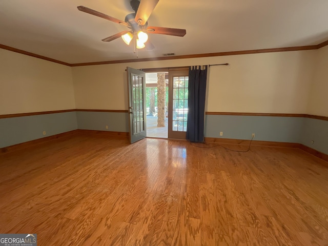 3222 US Highway 80 W, Dublin, GA 31021 - spare room with light wood-type flooring, ceiling fan, baseboards, and ornamental molding