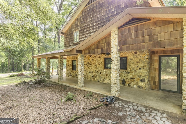 3222 US Highway 80 W, Dublin, GA 31021 - view of side of property with stone siding and mansard roof