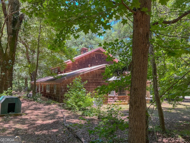 3222 US Highway 80 W, Dublin, GA 31021 - view of property exterior with a chimney and a barn