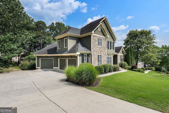 203 Crescent Moon Way, Canton, GA 30114 - view of front of property with stone siding, driveway, a front lawn, and a garage