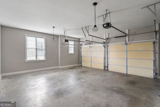 203 Crescent Moon Way, Canton, GA 30114 - garage featuring a garage door opener and baseboards